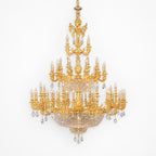 Large classic brass chandelier - front view of the candle arms and crystal basket tiers