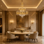 Large classic brass chandelier - lit above a round marble dining table in a warm-toned room